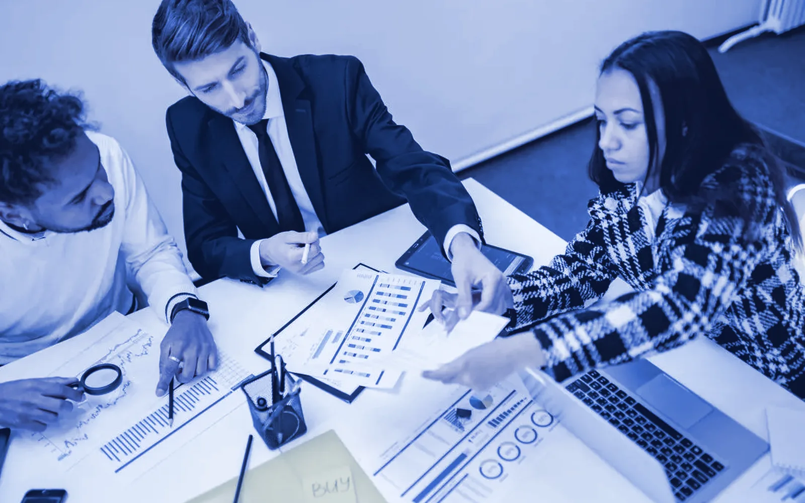 Small business team reviewing benefit options at a table